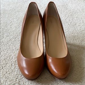 Brown leather pumps